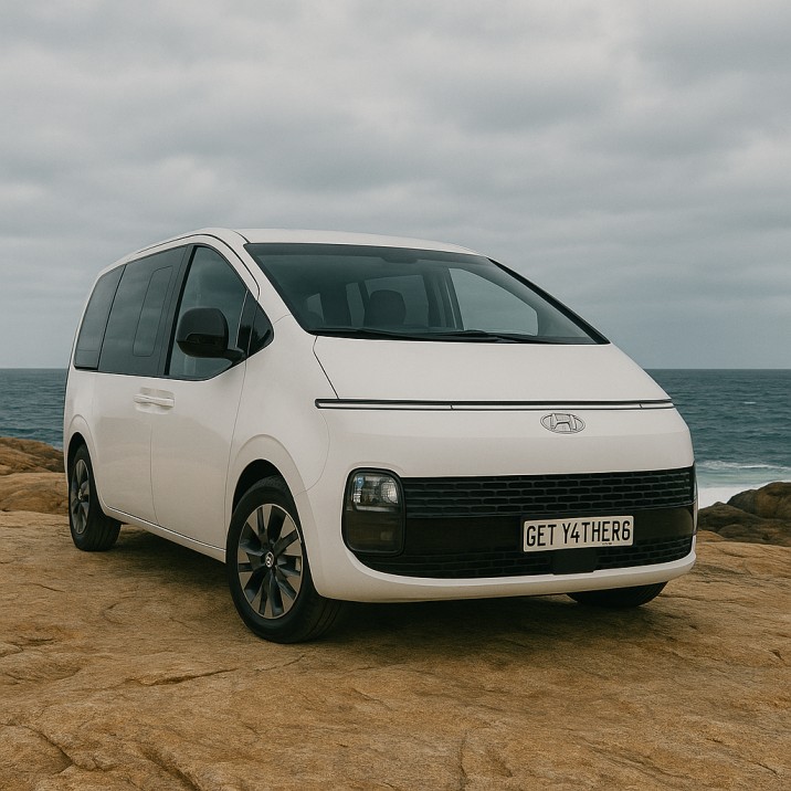 get ya there airport trasfer van parked on a rocky headland im=n Mandurah